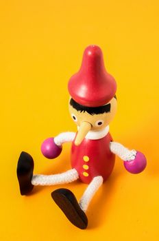 Pinocchio Toy Statue on a Colored Background