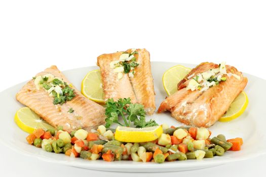 seafood salmon portion and vegetables