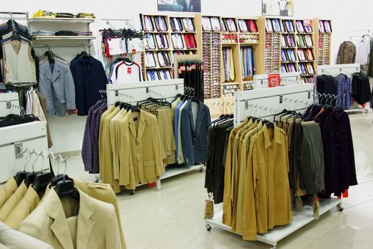 Men clothes in shop, elegant clothes shop.