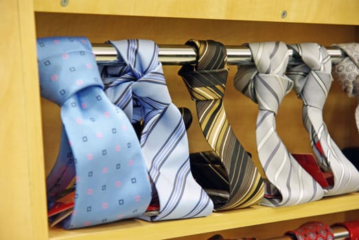 Colored men's necktie in a shop, close image
