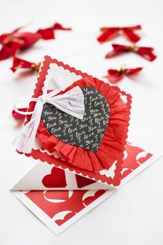 3D origami card with a black colored heart and a white ribbon.