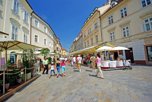 BRATISLAVA, SLOVAKIA - JULY 30: Ancient street in Bratislava, summer view. Many tourists visiting Slovakia on July 30, 2008  in Bratislava, Slovakia