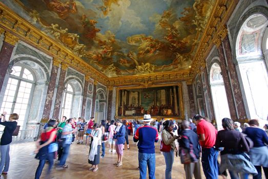 VERSAILLES, FRANCE - AUGUST 2: Tourists visiting Mirror's Hall, Versailles Palace on August 2, 2008 in Versailles, France