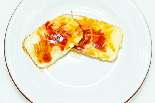 Eggs Baked in Muffin Tin with Salsa and Cheese in Plate