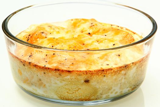 Oven Baked Eggs with Melted Cheese and Pepper in glass bowl.