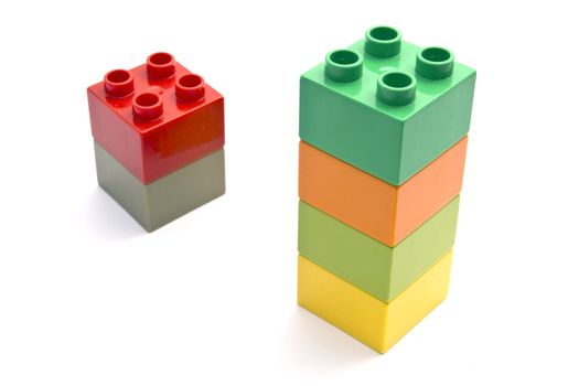 Colorful building blocks closeup on white 