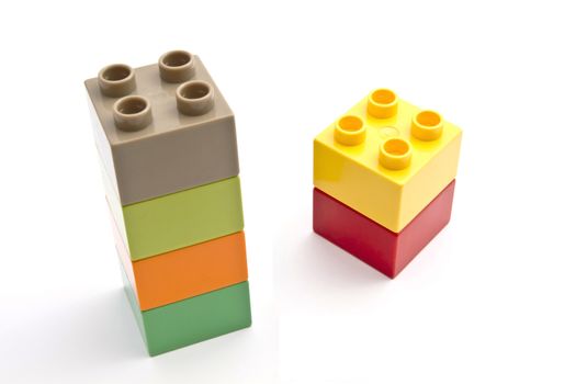 Colorful building blocks closeup on white