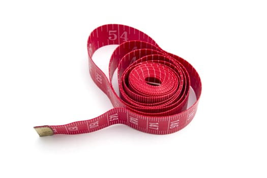 Red tape measure closeup on white background 
