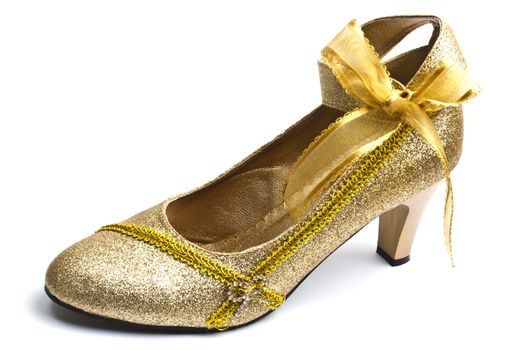 Beautiful golden shoe isolated on white