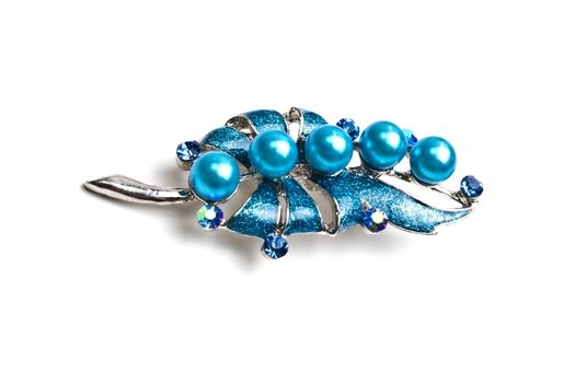 Beautiful blue brooch isolated on white background