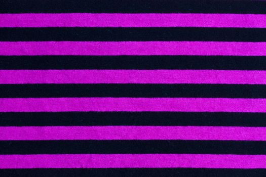 Texture of pink and black striped fabric background