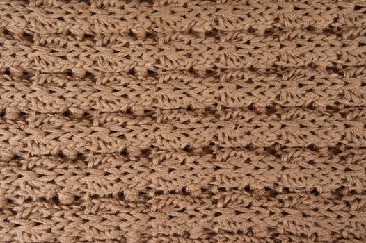 background of beige knitted woolen threads                 