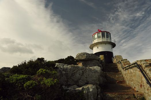 Lighthouse Cape of Good hope and blue sky with white clouds, Cape Town Lighthouse Cape of Good hope and blue sky with white clouds, Cape Town