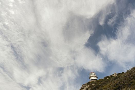 Lighthouse Cape of Good hope and blue sky with white clouds, Cape Town