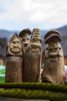 Wooden figures of gay people on green