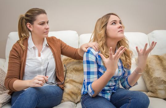 Furious young mother in a discussion with her teenage daughter. Problems between generations concept