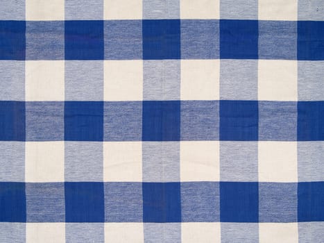 Photo of a blue checkered tablecloth.