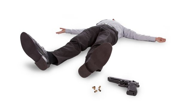 Businessman lying dead in the floor with a gun