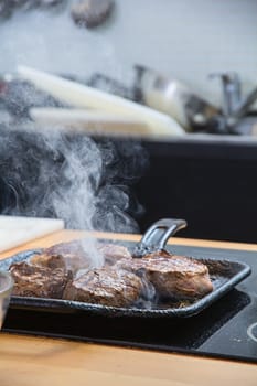Steak slices roasted on griddle