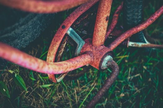 Retro Filtered Image Of A Detail Of An Abandoned Rusty Bike