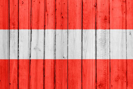 The Austrian flag painted on a wooden fence