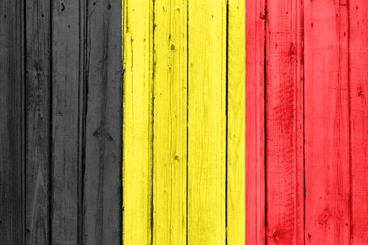 The Belgian flag painted on a wooden fence