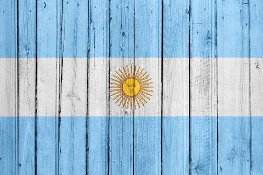 The Argentine flag painted on a wooden fence