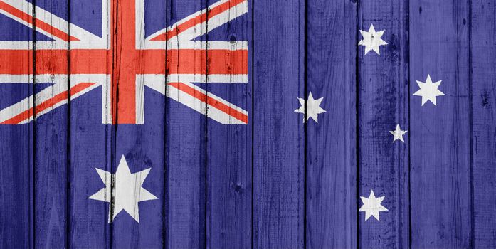 The Australian flag painted on a wooden fence