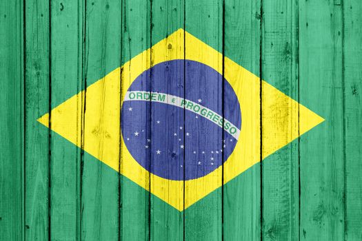 The Brazilian flag painted on a wooden fence