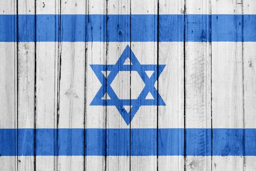 The Israeli flag painted on a wooden fence