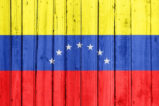 The Venezuelan flag painted on a wooden fence