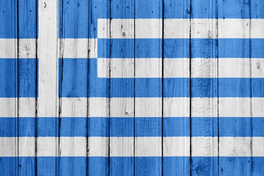 The Greek flag painted on a wooden fence