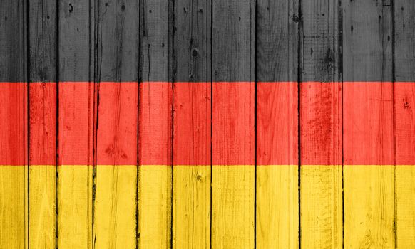 The German flag painted on a wooden fence