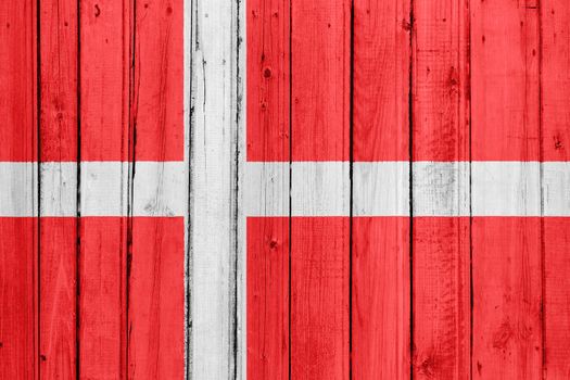 The Danish flag painted on a wooden fence