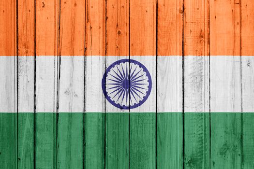 The Indian flag painted on a wooden fence