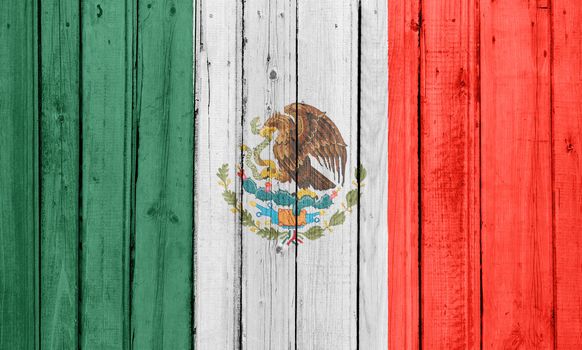 The Mexican flag painted on a wooden fence