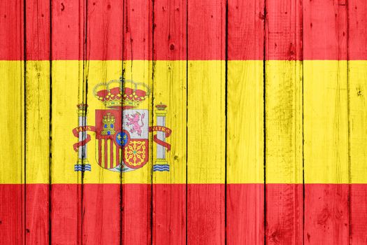 The Spanish flag painted on a wooden fence