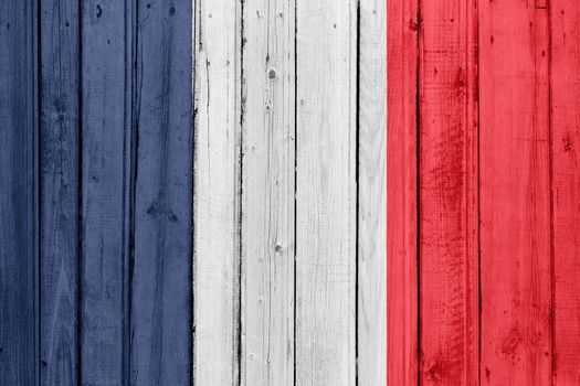 The French flag painted on a wooden fence