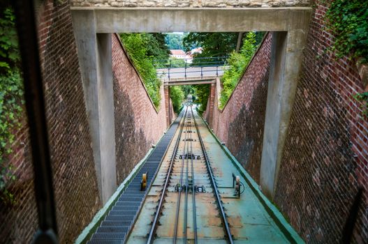 View on cable railroad from cabin of moving down funicular