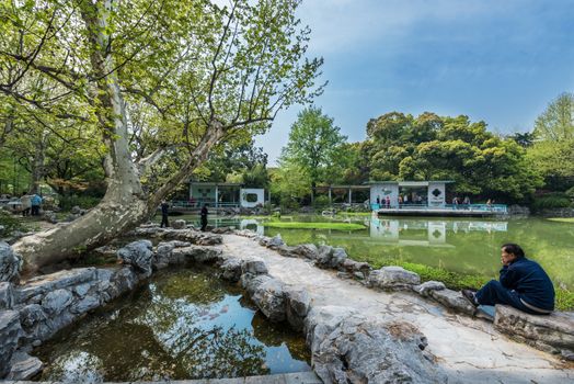 Shanghai, China - April 7, 2013:people resting in in fuxing park at the city of Shanghai in China on april 7th, 2013