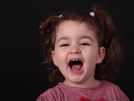 little caucasian girl with a beautiful happy expression
