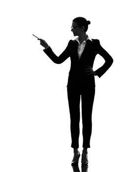 one caucasian business woman holding pen pointing showing in silhouette on white background