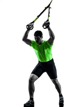 one caucasian man exercising  suspension training trx  on white background