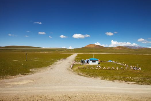 A chinese army outpost in Tibetan Plateau with mountain landscape in the background