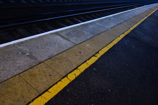 Train platform edge with yellow warning line