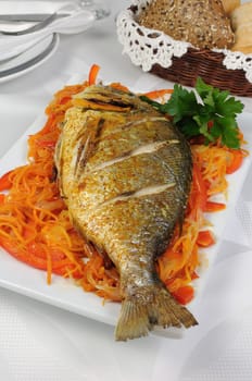 Fried Fish (Dorado) on a bed of vegetables