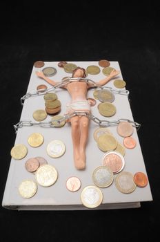 Jesus Christ and Money on a Dark Background - Religion Concept