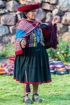 Cuzco, Peru - July 15, 2013: woman weaving in the peruvian Andes at Cuzco Peru on july 15th, 2013