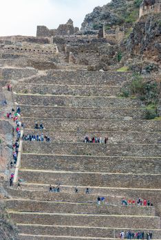 Ollantaytambo, Peru - July 16, 2013: tourists at Ollantaytambo, Incas ruins in the peruvian Andes at Cuzco Peru on July 16 2013