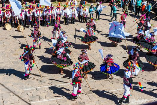 Puno, Peru - July 25, 2013: musicians and dancers in the peruvian Andes at Taquile Island on Puno Peru at july 25th, 2013.